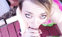 Dressed in pink cutie Carmen Callaway is sucking in the garden