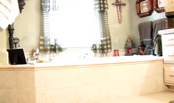 Babe in pantyhose strokes her pussy after getting topless