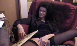 Black-haired milf in black stockings is having a nice dildo