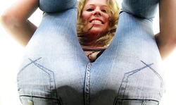 Stunning smiling blonde shows off her awesome tight jeans