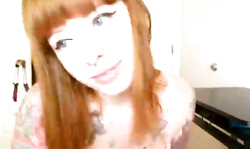 Emo chick with tattooed hands shoves her dildo in tight wet muff