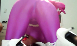 Impressive beauty in purple spandex tights is trying to escape