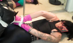 Tattooed brunette in black spandex tights is having awesome butt