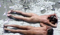 Young brunette and her boyfriend are enjoying nudism