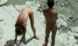 Cute slender brunette gets spotted naked on the beach