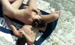 Cutie with nice round ass gives a blowjob on the beach