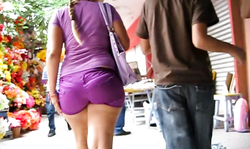Bright purple outfit just emphasizes her stunning big booty