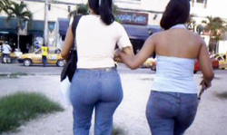 Two chicks in blue jeans are having awesome big booties
