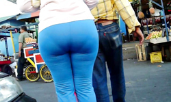 Walking on the street and filming an awesome big booty babe