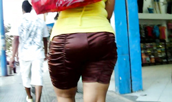 Sexy and awesome big booty of a babe in silk skirt