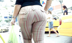 Tight striped pants are only emphasizing her big booty