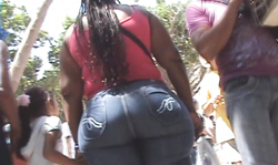 Long-haired brunette is having a very wide big booty