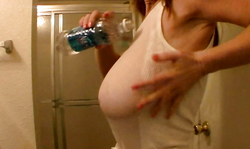 The sexiest milf Candi Curves goes topless in the bathroom