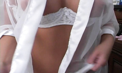 Glamorous Candy Girl poses in a see-through white lingerie