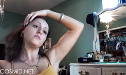 Sensual Cosmid is applying makeup and grabbing a curly wig