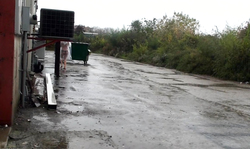 Naked Nikki Sims is walking outdoors in the raincoat