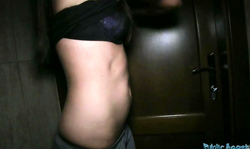 Elegant brunette with long hair is kneeling down after getting money