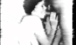 Retro babe is lying on the bed and sucking a massive cock