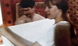 Smiling Retro girl from 70's gets naked in the massage saloon
