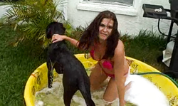 The sexiest big-boobed teen gf bathes her dog in outdoor pool