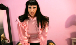 Black-haired MILF Trinity bares her pussy in a hot way