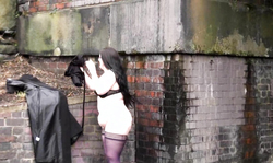 Brunette in stockings strokes her tight snatch on the bench in public place