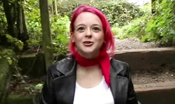 Pregnant redhead female slowly undresses on the bridge