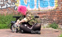 Sexy pink-haired UK mature sucks a dildo in public place
