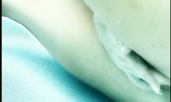 Fake-boobed brunette with long legs masturbates underwater