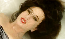 Dark-haired babe with red lips masturbates with love