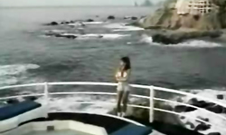 Busty babe Racquel Darrian sucks a dick on the beach