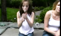 Fully naked young babes are fucking outdoors with a strapon