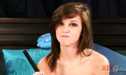 Gorgeous teen brunette with big tits is playing with a toy