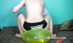 Small-tit brunette balloon is jumping on a big balloon