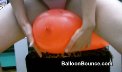 Stunning lady with huge red balloon likes balloon fetish