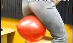 Hot-looking amateur babe in black jeans is sitting on a balloon