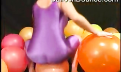 Lady in purple tight definitely likes balloon fetish