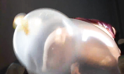 Lass in latex dress has a very nice bushy pussy and a big balloon