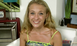 Smiling cutie with shaved pussy demonstrates her solo skills