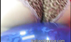 Sensual busty blonde with pierced nipples rides a balloon
