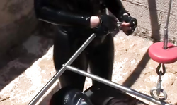 Redhead sex slave is getting humiliated by Domina in black latex