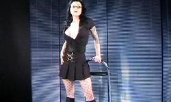 Teacher in black dress is trying hard to not getting naked