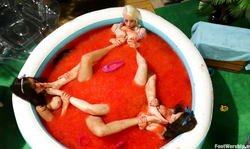 Small red pool filled with Lorelei Lee, Casey Calvert and Rilynn Rae