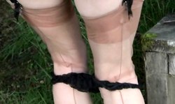 Sexy-looking amateur mom in Stockings undresses in the forest