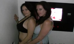 Two skillful Gloryhole sluts are blowing two dicks simultaneously